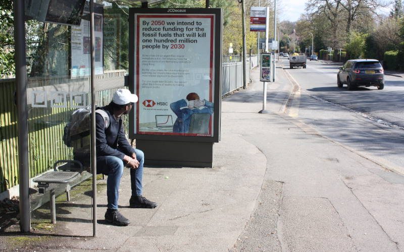 A spoof HSBC advert on a bus shelter